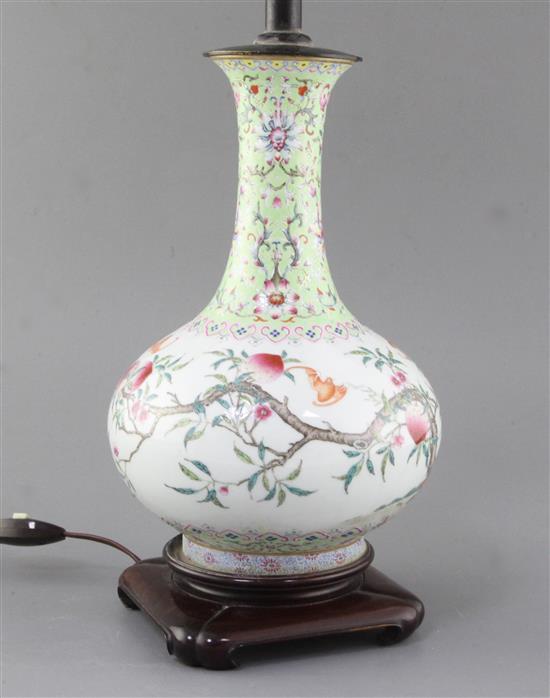 A Chinese famille rose nine peach bottle vase, Qing dynasty, total height 48.5cm including stand and fittings, some restoration